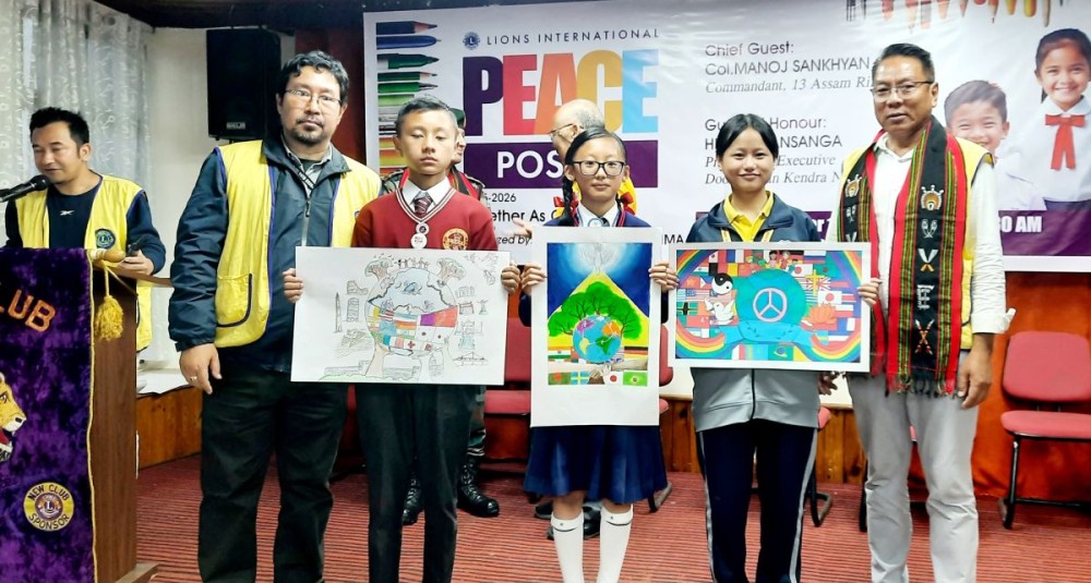 Hruyia Irene (3rd right) of Little Flower Higher Secondary School, Kohima, displays her poster that won the first position in the competition. Monoteo Ritse (2nd right) of Ministers’ Hill Baptist Higher Secondary School, Kohima, secured the second position, while Vikusier Kuotsu (3rd left) of St Mary’s Cathedral Higher Secondary School, Kohima, won the third position.